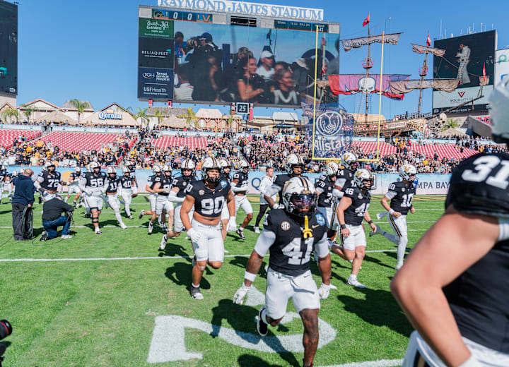 Vanderbilt players run onto the field before kickoff